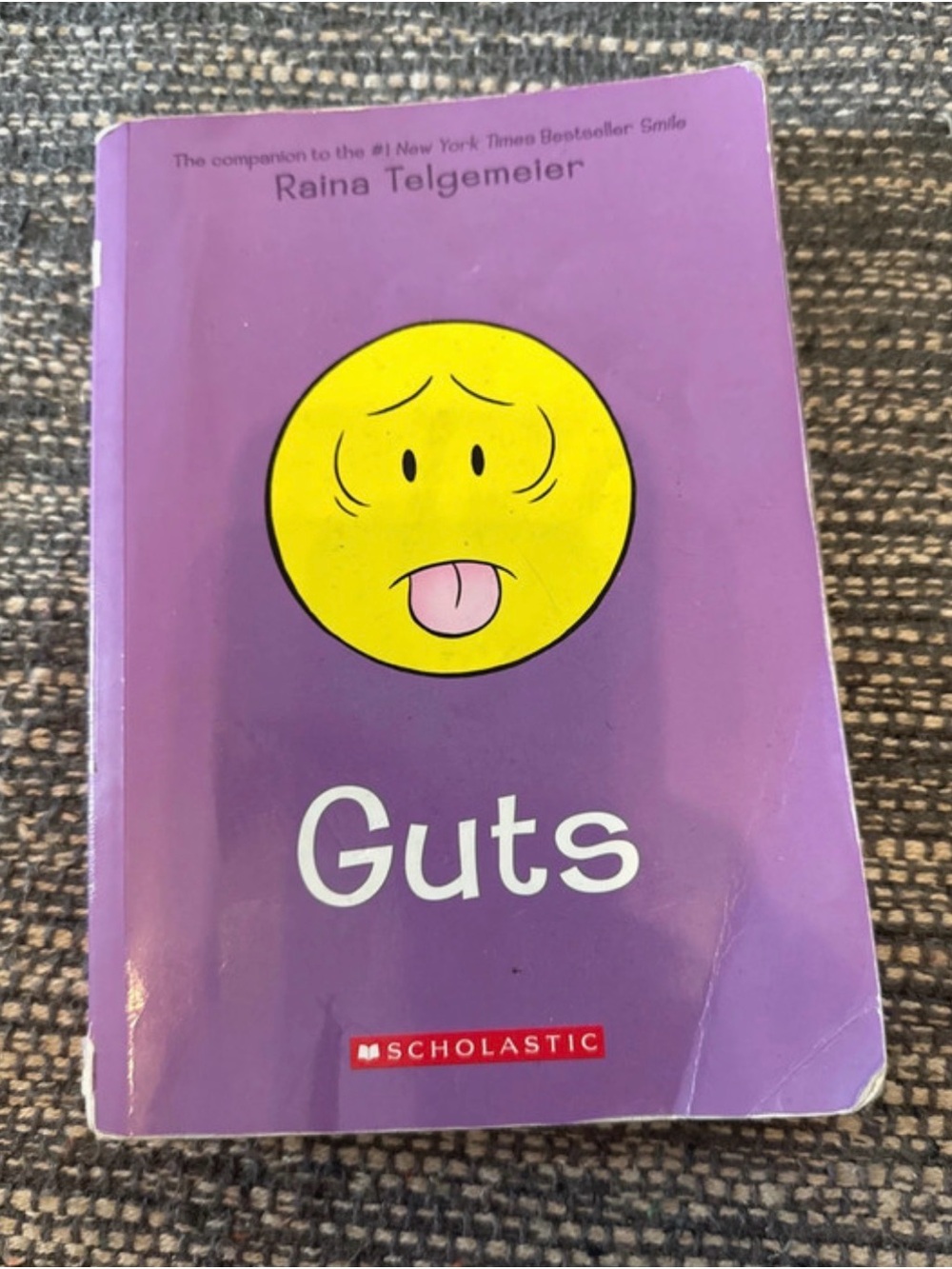 Scholastic Purple Cover "Guts" Graphic Novel with Yellow Emoticon